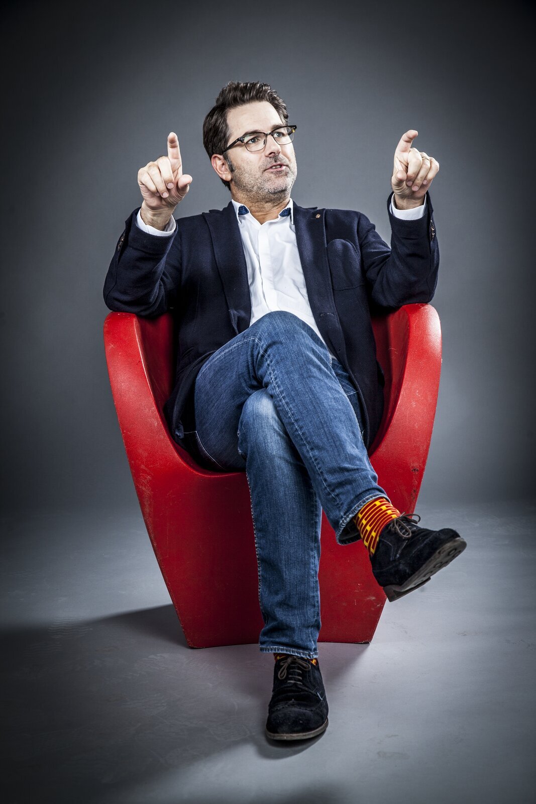 Jaimie Fuller, seated, mid-conversation